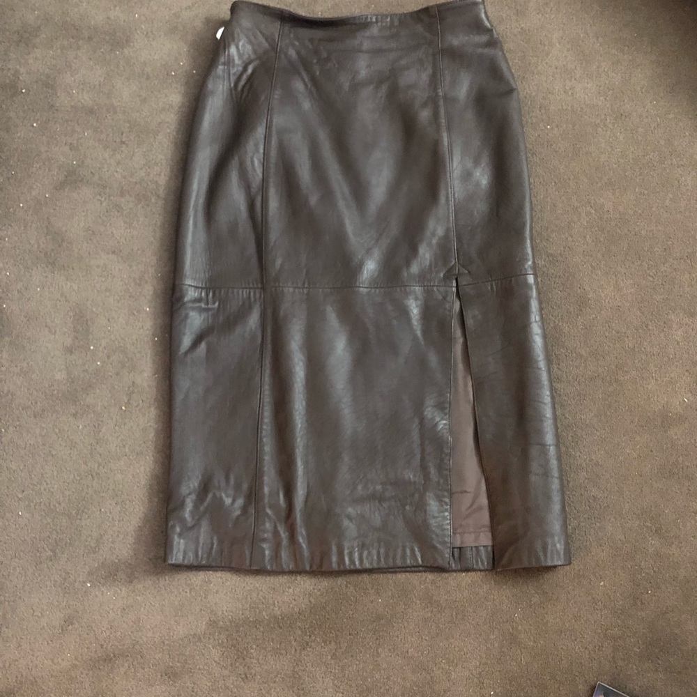 2  leather skirts. Black and brown. Size 14.